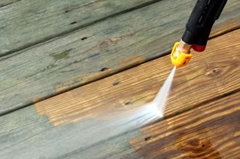 Pressure washing a wood deck before refinishing