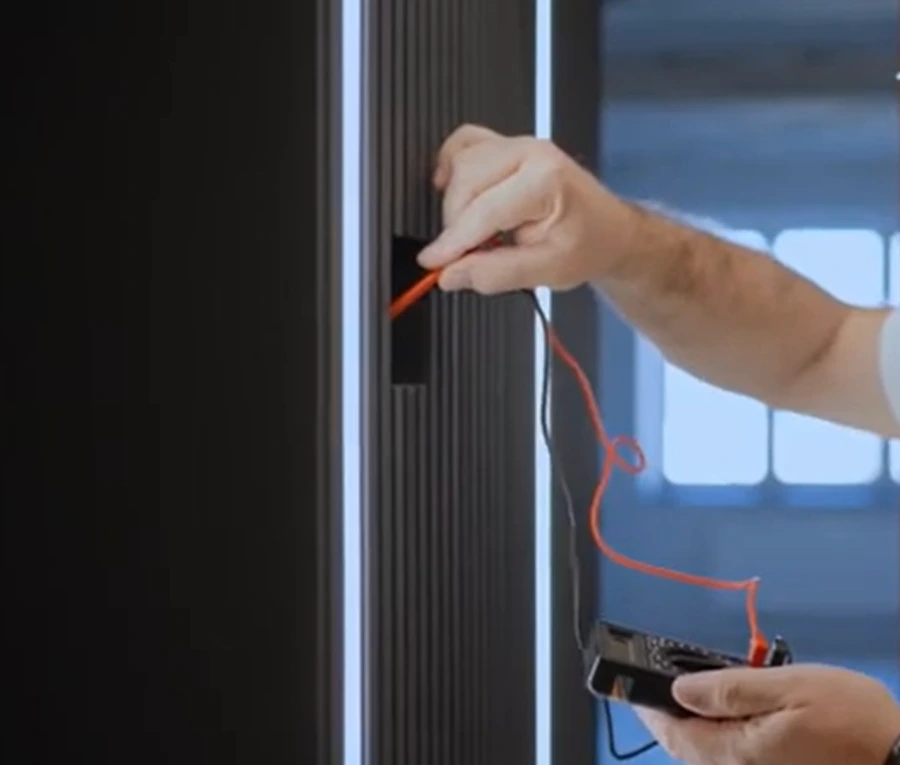 Handyman testing an electrical connection with a multimeter