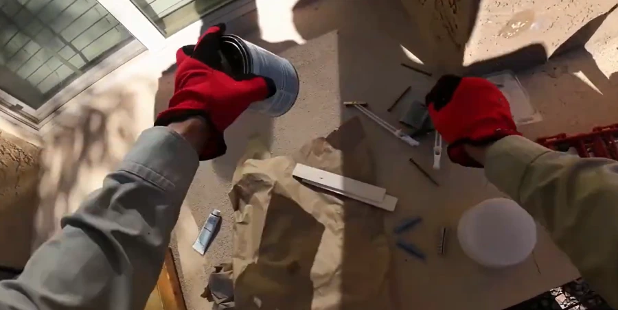 Handyman preparing paint supplies for an exterior job
