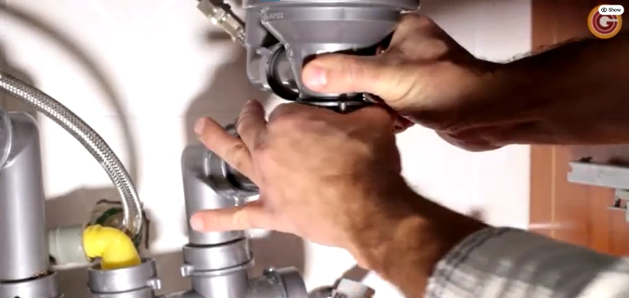 Installing a garbage disposal under a kitchen sink in Centerville, Ohio